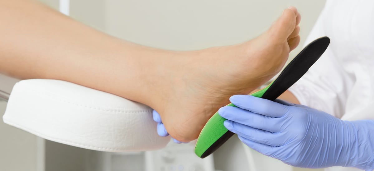 Patient getting fitted for a shoe orthotics