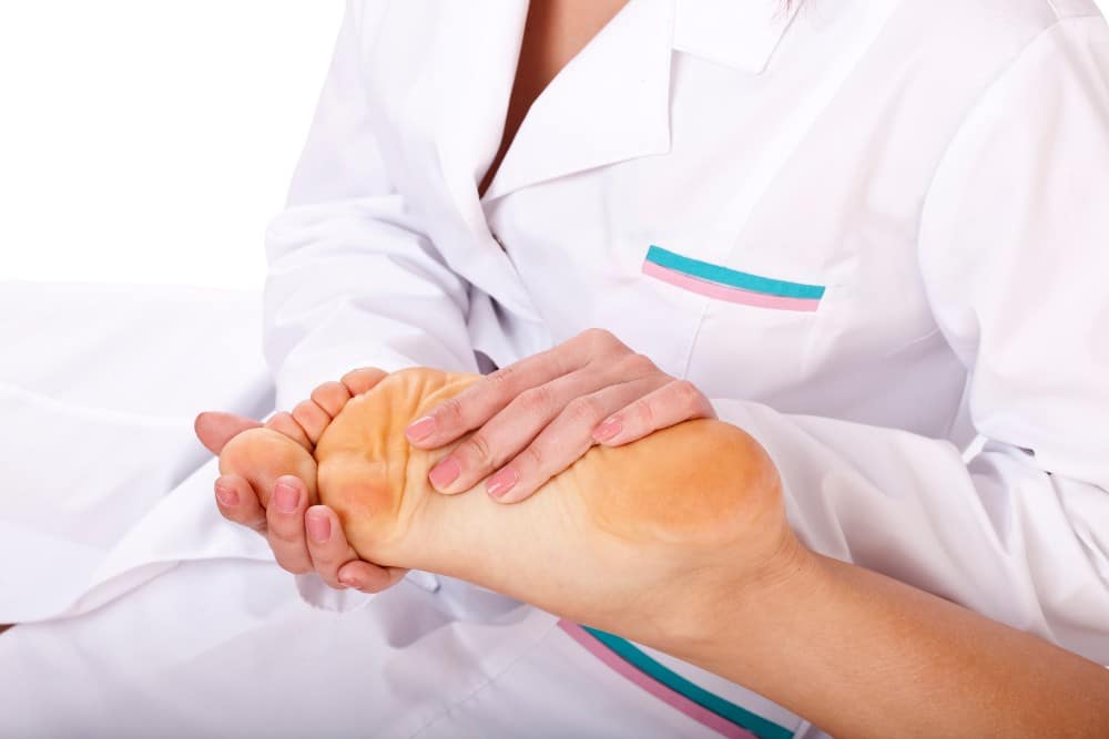 Podiatrist treating foot sports injuries